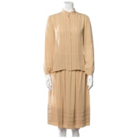 a mannequin mannequin wearing a beige dress